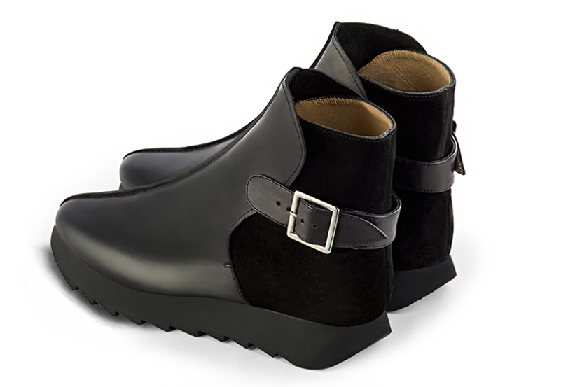 Satin black women's ankle boots with buckles at the back. Round toe. Low rubber soles. Rear view - Florence KOOIJMAN